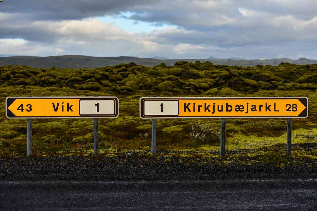 Route 1 signs for V&iacute;k and Kirkjub&aelig;jarklaustur near F206 junction.