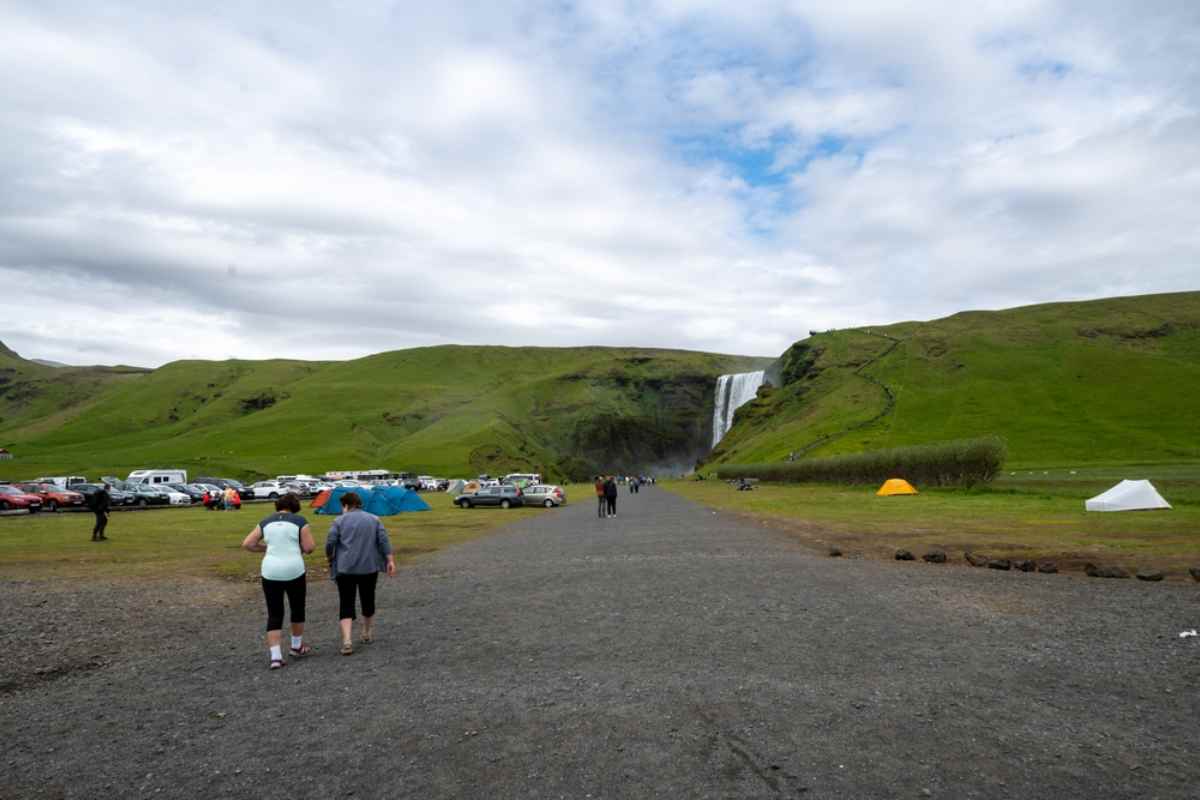 General view of a campground located near the Sk&oacute;gafoss waterfall in Iceland where many people park their vehicles for camping.
