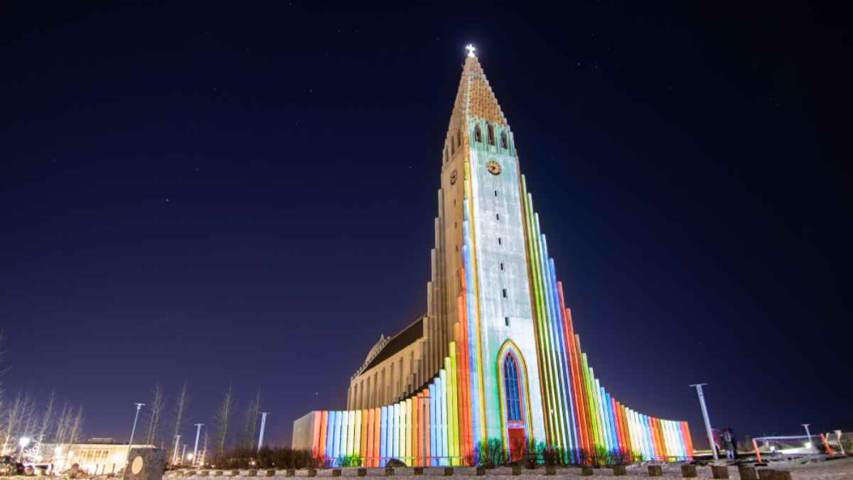 General view of the facade of the National Church of Iceland completely ornamented with colors thanks to the projection of lights coinciding with the Winter Lights Festival in that country.