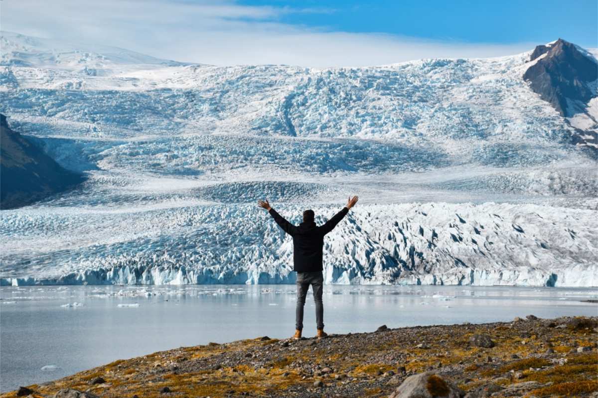 Tourist enjoying the impressive views of Iceland's glaciers