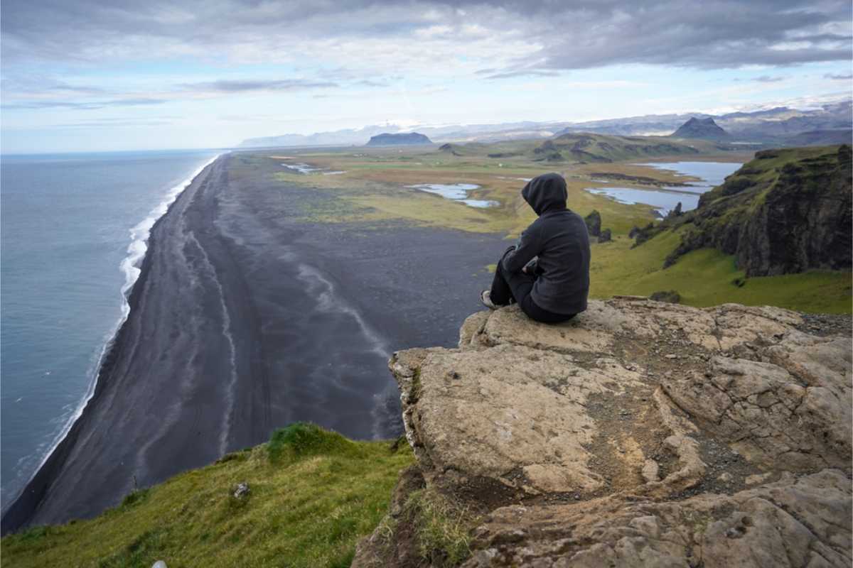 Visitor enjoying the views from Dyrholaey viewpoint